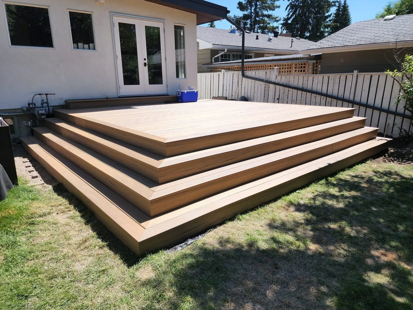 Finished low-maintenance deck with wraparound steps